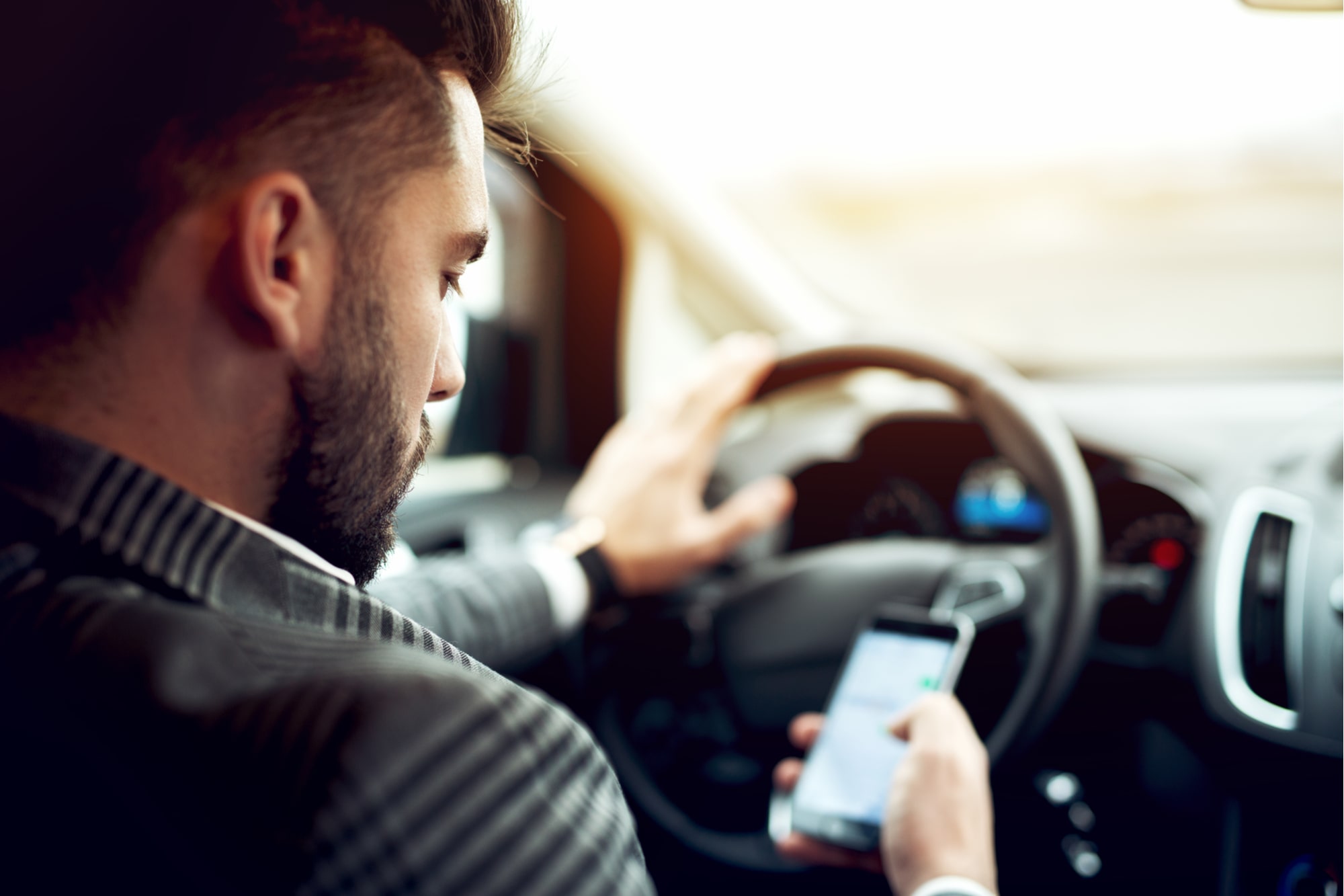 The Dangers of Distracted Driving: Phones, Eating & Adjusting Controls